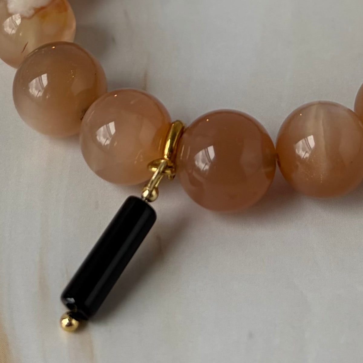 Sovereign Peach Moonstone Bracelet with Black Onyx Pendant Charm
